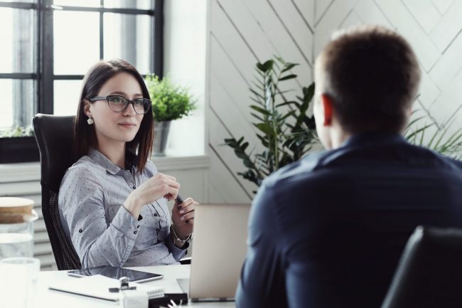 Picture of hiring manager illustrates blog: 5 Ideas to Get Unrehearsed Answers in Job Interviews