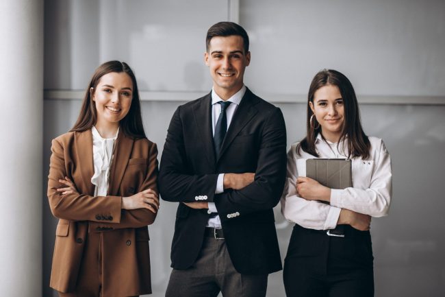 Photo of confident employees illustrates blog "Tips to Win the War for Talent "