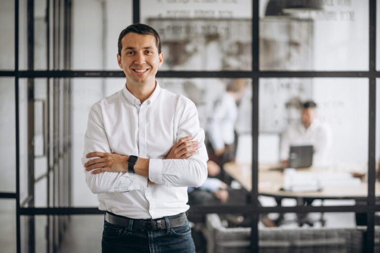 Photo of confident business owner illustrates blog: "How to Stand Out as an Employer"