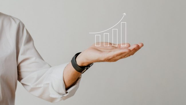 Graphic of upward arrow above man's hand illustrates blog "4 Ideas To Increase Productivity in your Business "