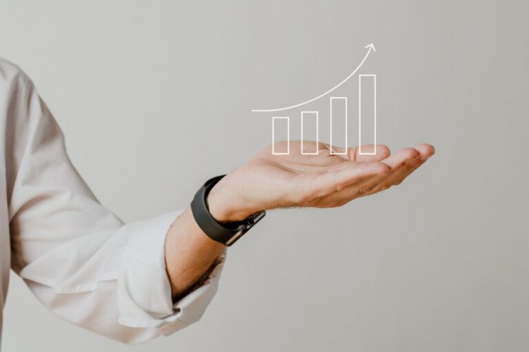 Graphic of upward arrow above man's hand illustrates blog "4 Ideas To Increase Productivity in your Business "