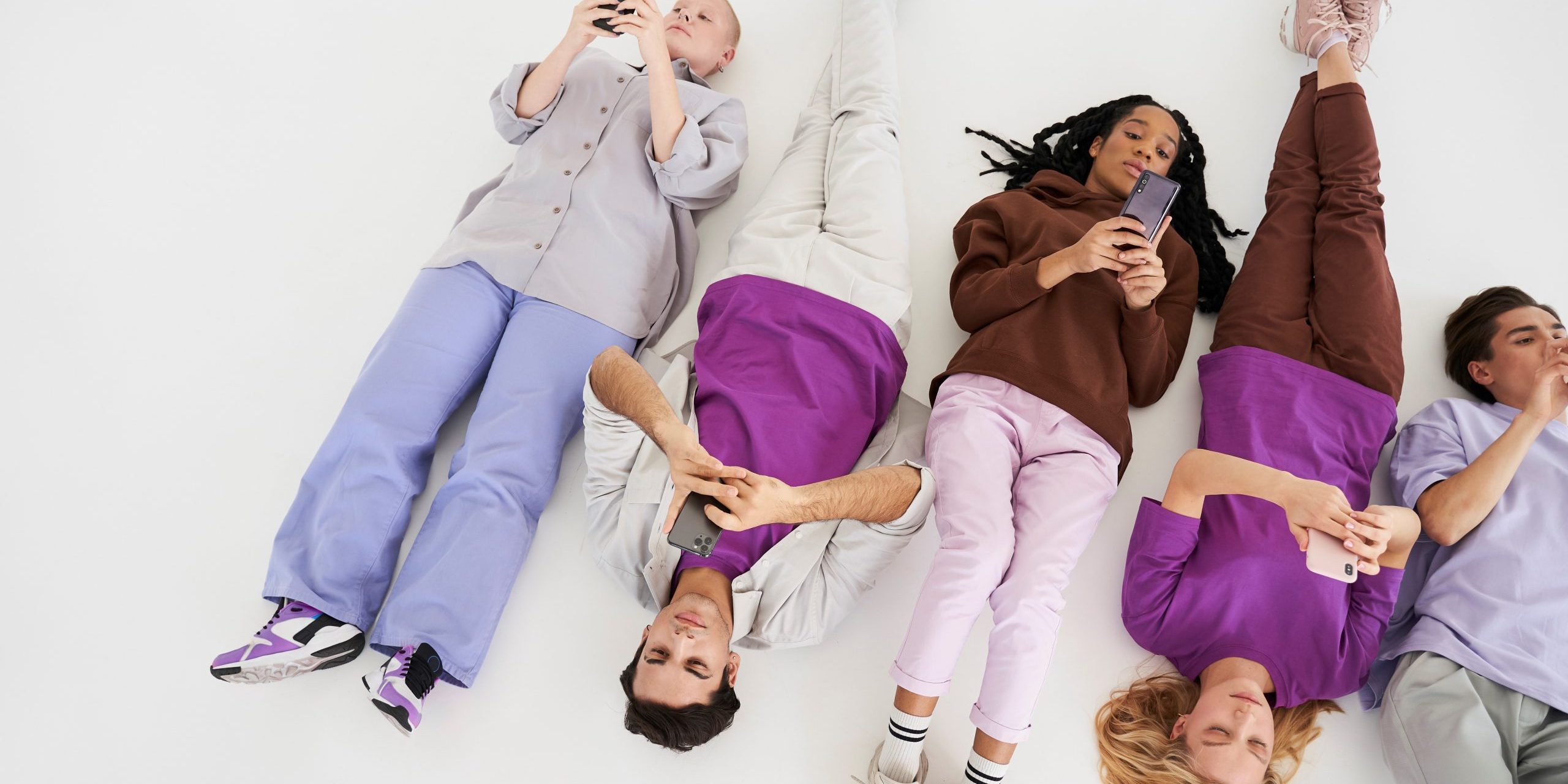 gen-z-FP Young people lying on the ground illustrate blog "How to Retain Gen Z Employees"