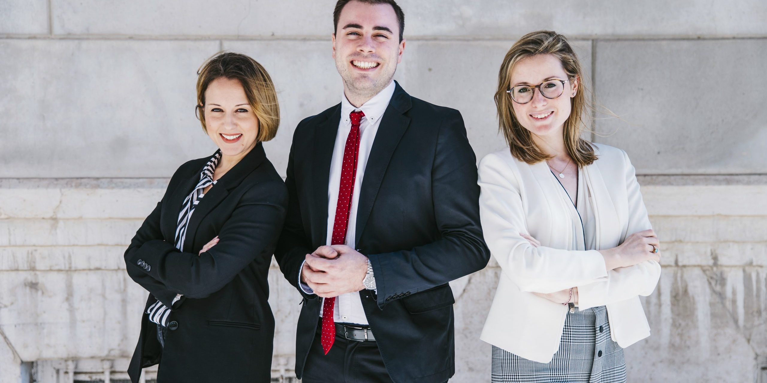 executives2-fp Three smiling office workers.