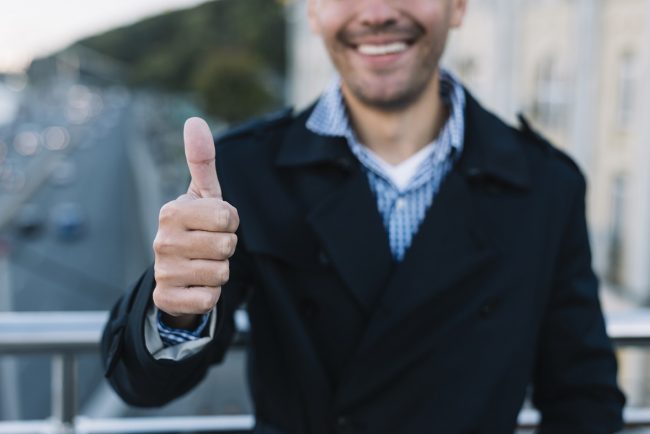 thumbs-up-freepik-2 Man giving thumbs up illustrates blog "The Importance of Accurate Employment Verification"