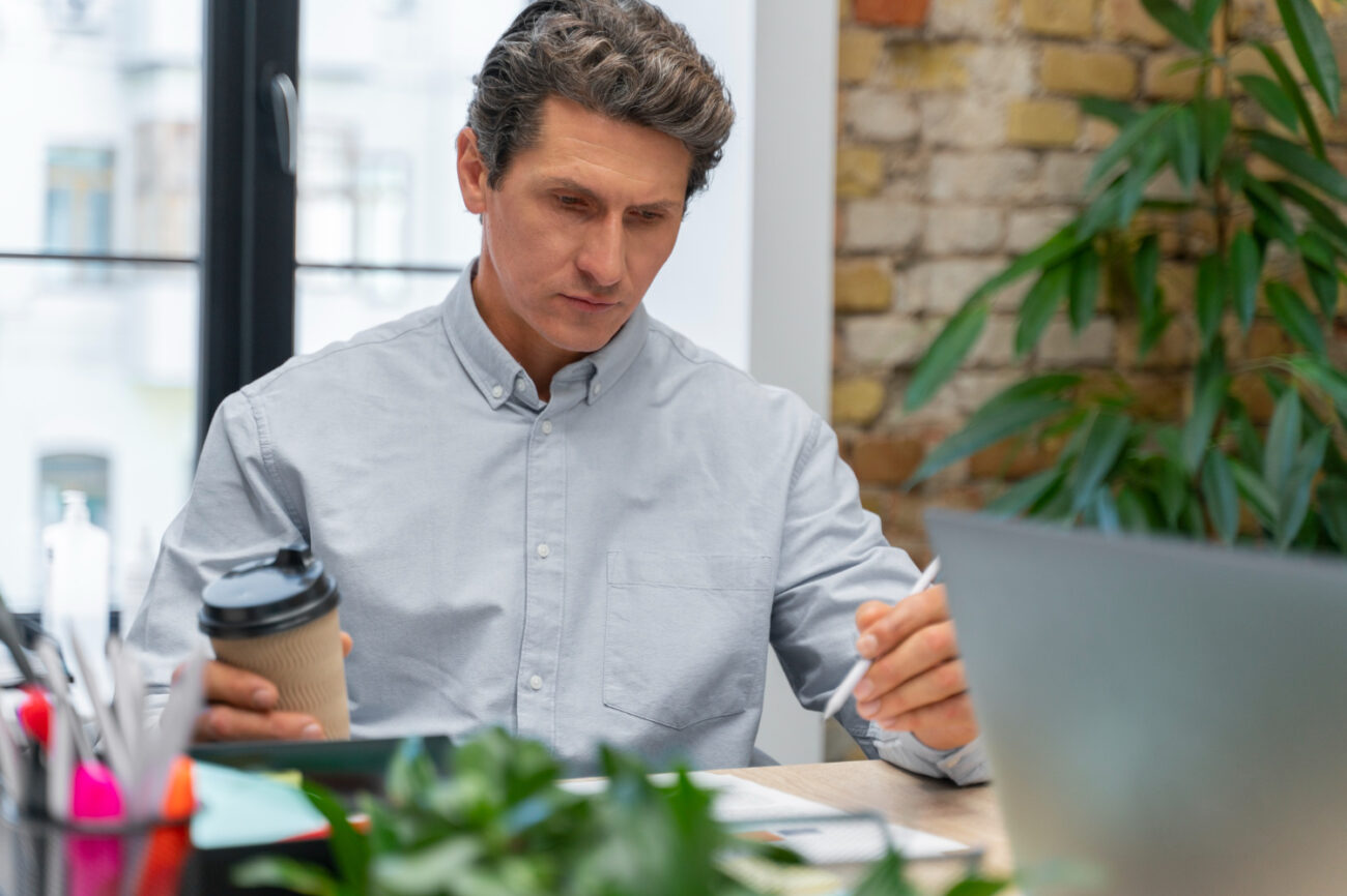 close-up-young-HR HR manager reviewing credential verification for new hire in FinTech or cannabis industry