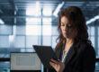 HR professional reviewing I-9 and E-Verify compliance records