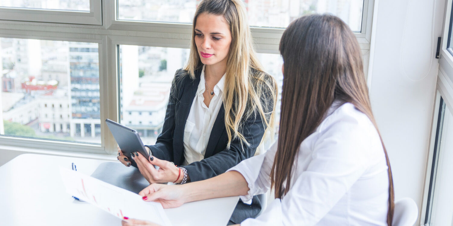 2147904755 HR professional discussing employer brand background checks with job candidate