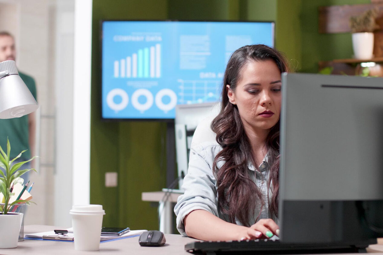 28686 HR manager reviewing continuous monitoring dashboard for employee screening