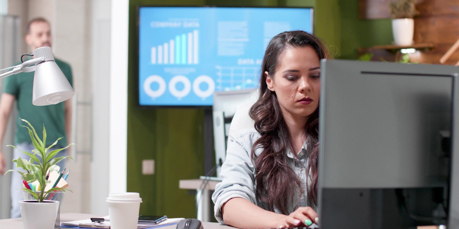 28686 HR manager reviewing continuous monitoring dashboard for employee screening