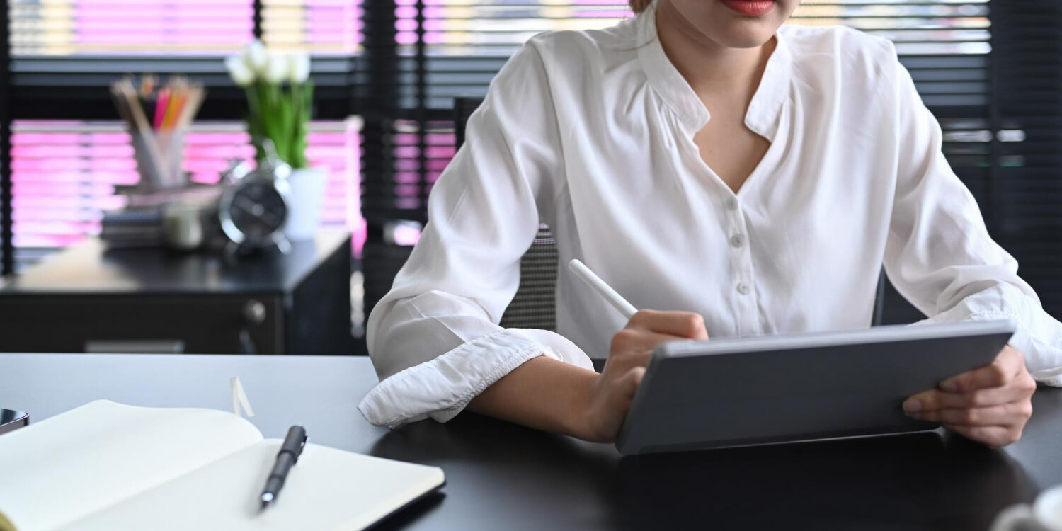 HR manager reviewing background check compliance documents on laptop