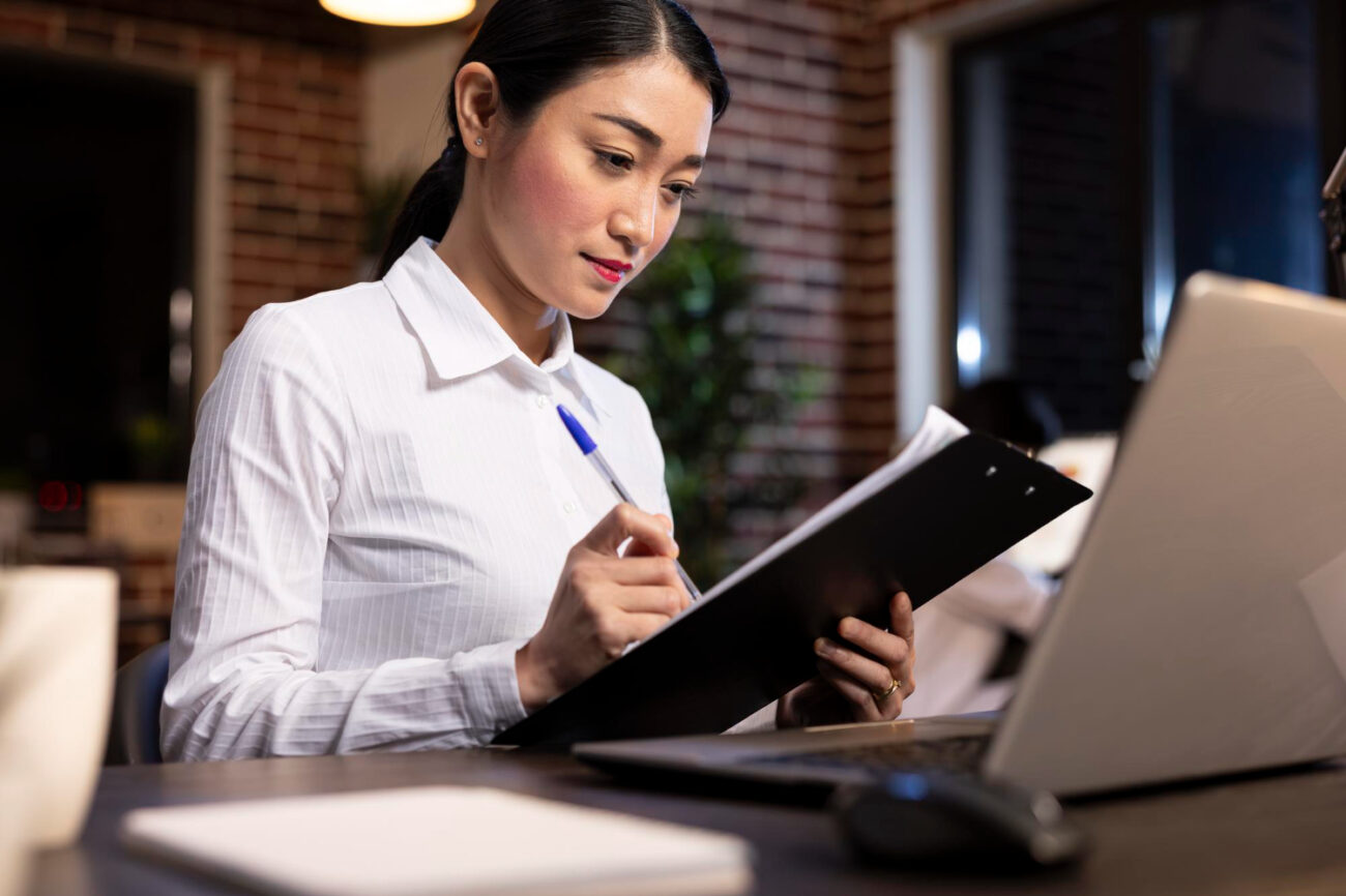 HR professional auditing a background screening policy for compliant hiring