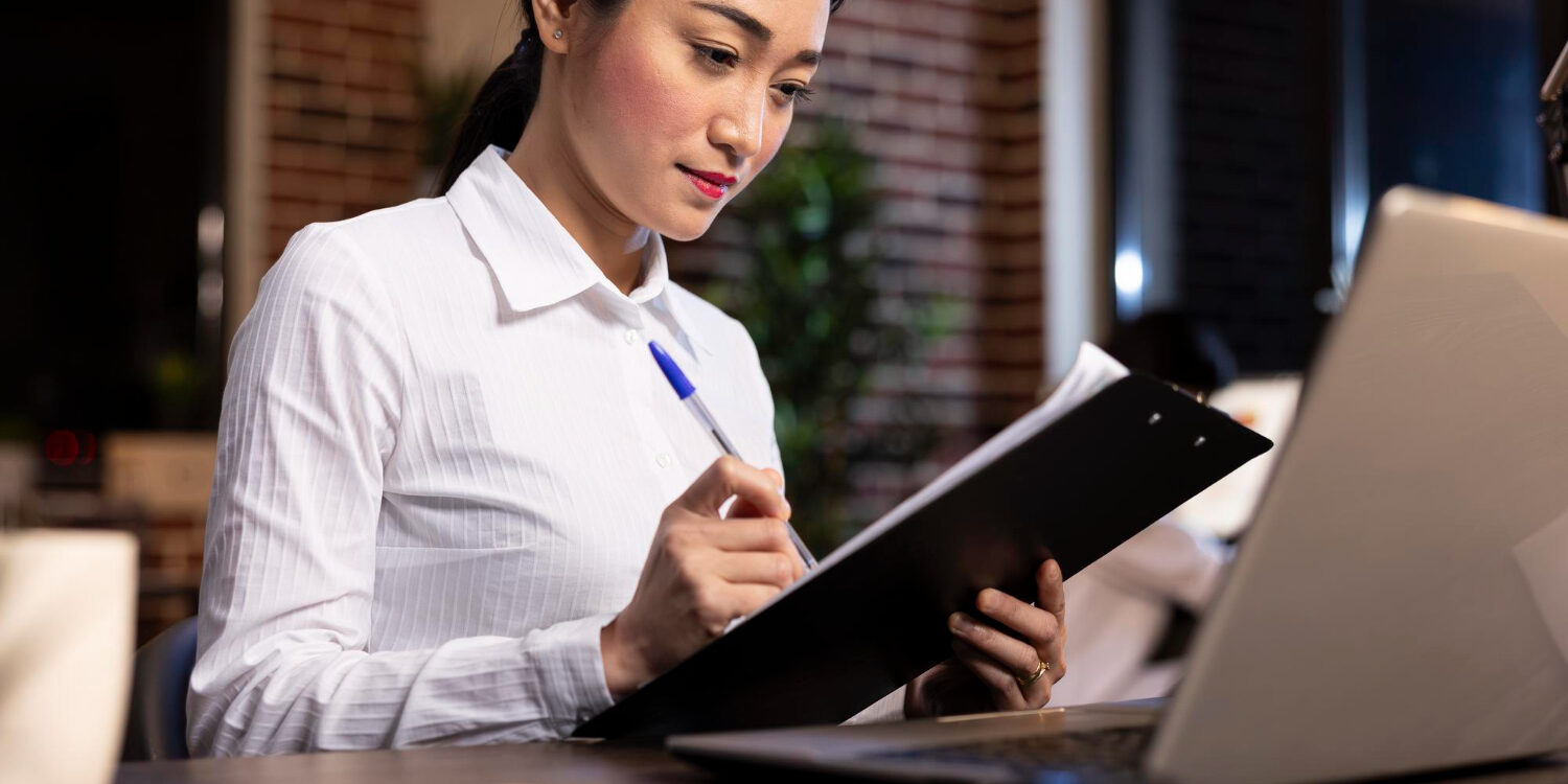 HR professional auditing a background screening policy for compliant hiring