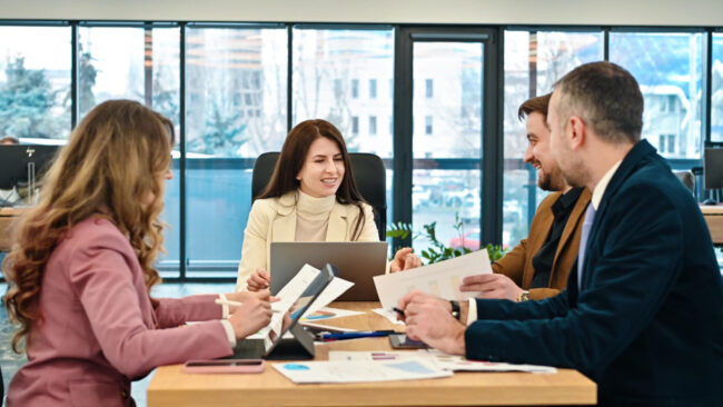image-HR-team-discussing-employee-re-screening HR team discussing employee re-screening policy and role changes
