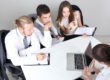 HR team preparing for a background screening audit with a compliance checklist