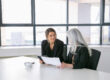 HR professional reviewing employment gap verification during candidate assessment