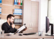 HR professional completing reference checks during a digital hiring process